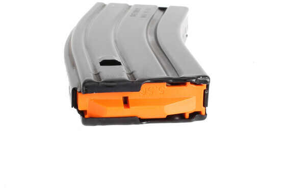 The C Products 556 magazine features an orange anti tilt follower and stainless steel spring